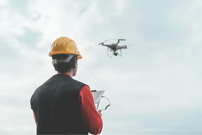 male engineer monitoring construction site with drone technology and industrial concept 1